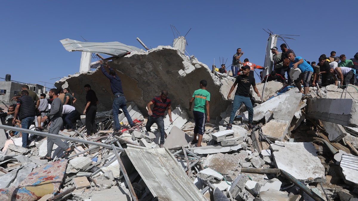 Palestinians inspect their house, after it was destroyed by an Israeli air strike on the city of Rafah in the southern Gaza Strip, on November 10, 2023.