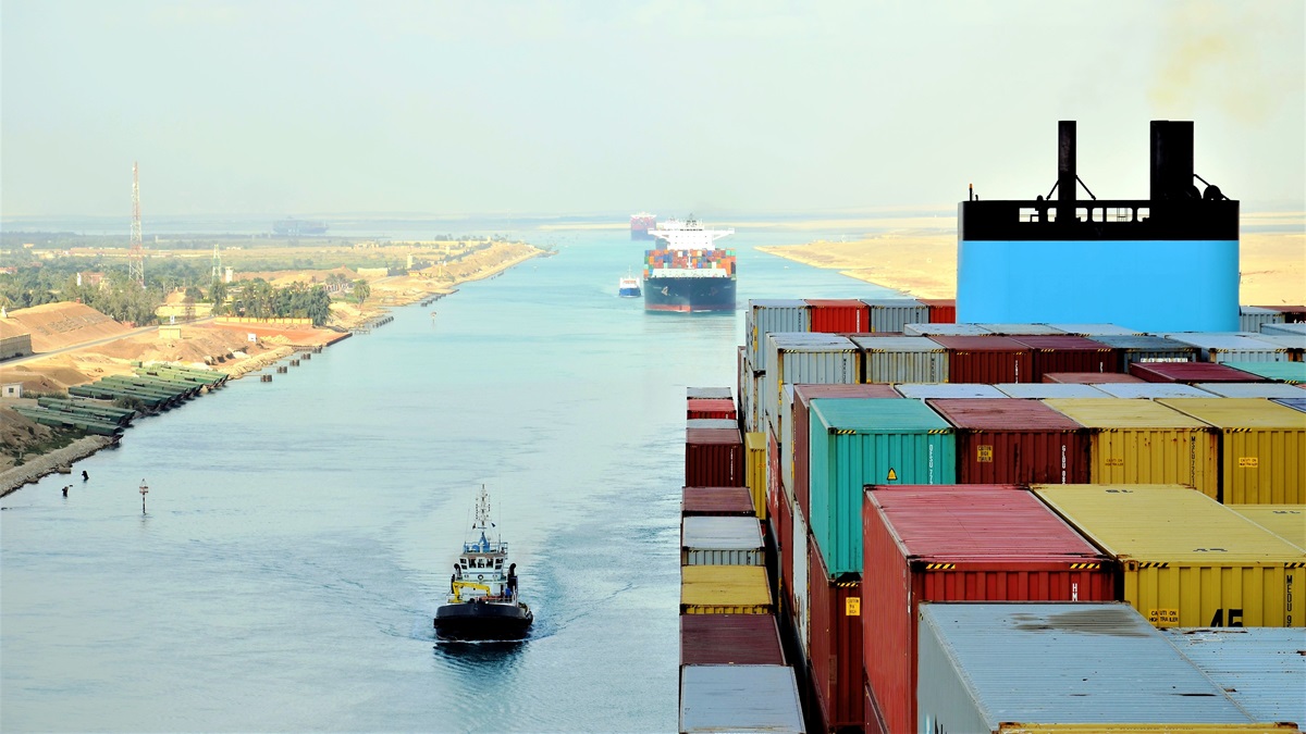 Cargo ships pass through the Suez Canal.