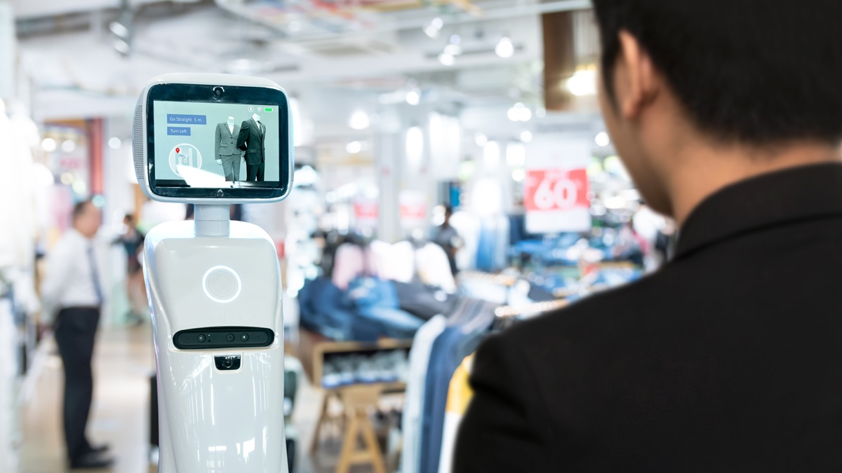 A customer interacts with an artificial intelligence robot in a shopping mall.